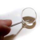 Nerezová lžička s lupou Thumb